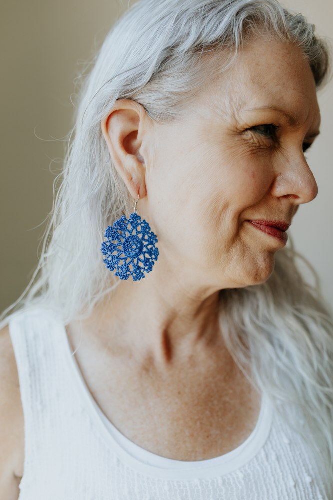 Woman wearing the KISA Crochet Earrings in Blueberry