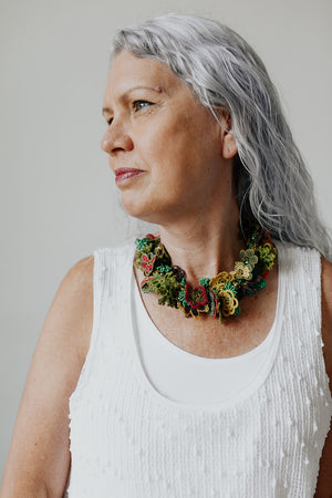 Woman wearing the Crochet Bouquet Necklace in Garland