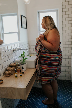 
            
                Load image into Gallery viewer, Woman wearing the Rainbow Pattern Towel as a towel wrap
            
        