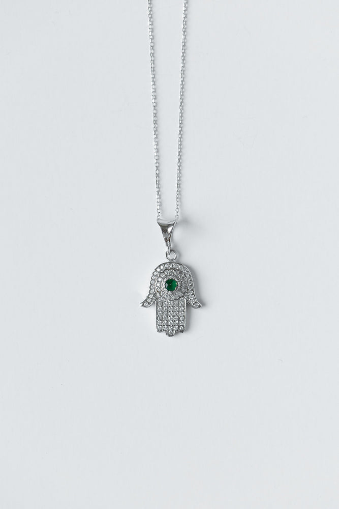 
            
                Load image into Gallery viewer, Hamsa + Evil Eye Silver Necklace with Emerald Gem
            
        