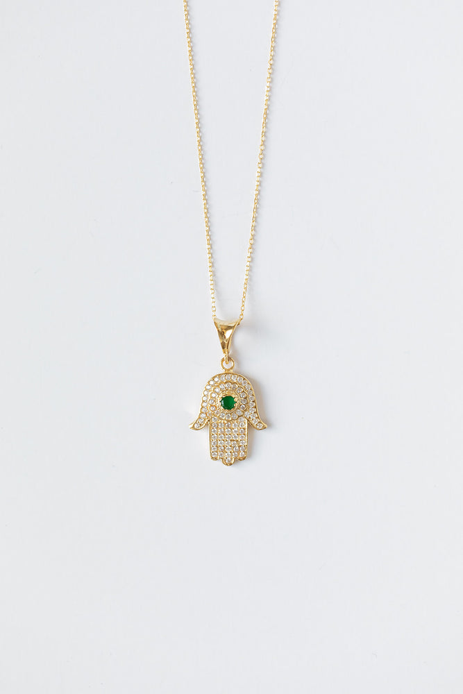 
            
                Load image into Gallery viewer, Hamsa + Evil Eye Gold Necklace with Emerald Gem
            
        